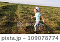 boy runs around a natural park in the open air. Fitness park Happy Boy, running outdoors. 109078774