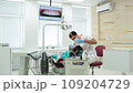 Cute young girl is being examined by the dentist 109204729