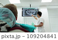 Cute young girl is being examined by the dentist 109204841