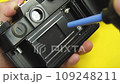 Cleaning of photographic equipment. Cleaning dust and dirt from the camera lens and sensor. 109248211