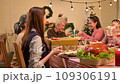 Happy asian people celebrating on a table meal when christmas and new year at home. 109306191