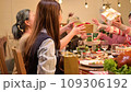Happy asian people celebrating on a table meal when christmas and new year at home. 109306192