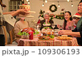 Happy asian people celebrating on a table meal when christmas and new year at home. 109306193