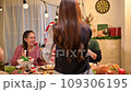 Happy asian people celebrating on a table meal when christmas and new year at home. 109306195
