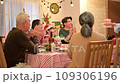 Happy asian people celebrating on a table meal when christmas and new year at home. 109306196