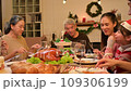 Happy asian people celebrating on a table meal when christmas and new year at home. 109306199