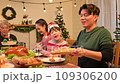 Happy asian people celebrating on a table meal when christmas and new year at home. 109306200