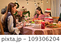 Happy asian people celebrating on a table meal when christmas and new year at home. 109306204