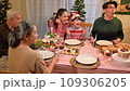 Happy asian people celebrating on a table meal when christmas and new year at home. 109306205