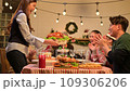 Happy asian people celebrating on a table meal when christmas and new year at home. 109306206