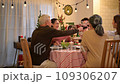 Happy asian people celebrating on a table meal when christmas and new year at home. 109306207