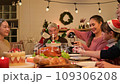 Happy asian people celebrating on a table meal when christmas and new year at home. 109306208