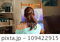 Talented Brunette Artist Captures Creativity While Painting on Canvas 109422915