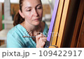 Studio Painting Session: Adult Woman Artist on Canvas 109422917