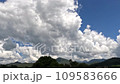 Time-lapse of beautiful blue sky with cloudy movement over green mountain and meadow rice plantation field 109583666
