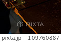 Jigsaw cuts a board. Electric jigsaw cuts a wooden slab. A piece of furniture is cut with a saw in a carpentry workshop. Assembling furniture in a factory. Carpenter works with wood. Professional tool 109760887