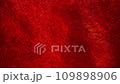 Slow Motion of gold particles in a red liquid. Impressive spectacle of sparkling shiny particles in red fluid motion. Abstract flaming moving background in 4K resolution.  109898906