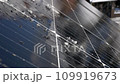 Snow Melting on PV Solar Panels Located on Private House Roof on Sunny Day 109919673