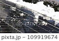 Snow Melting on PV Solar Panels Located on Private House Roof on Sunny Day 109919674