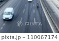 blurred background with top view cars and vehicles driving on motorway 110067174