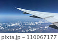 Airplane flight above clouds and land 110067177