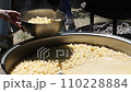 Tomato soup with pasta is a dish of Polish cuisine. Hot Zupa pomidorowa in a large cauldron at the field kitchen at a food fair. A popular soup made from grated tomatoes in their own juice 110228884