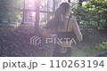 oung fitness sports women runner running in the park. Happy athletic woman listening music on earphones while running in nature in the morning. 110263194