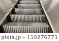 Empty working escalator upstairs moving up 110276771