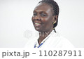 young woman doctor standing with stethoscope smiling to wave with fingers young woman doctor standing with stethoscope smiling to wave with fingers 110287911