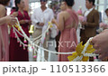 bridal friends holding flower line as barrior to ge bridal in Thailand cwedding ceremony 110513366
