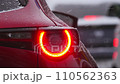 Winter, traffic jams, snow falling on car taillights 110562363