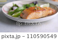 Grilled salmon fillet and fresh vegetable salad. Mediterranean diet.  110590549