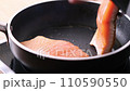 Pan-fried Salmon. Cooking salmon in a pan. 110590550