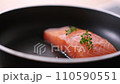 Pan-fried Salmon. Cooking salmon in a pan. 110590551