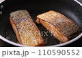 Pan-fried Salmon. Cooking salmon in a pan. 110590552
