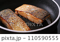 Pan-fried Salmon. Cooking salmon in a pan. 110590555