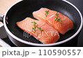 Pan-fried Salmon. Cooking salmon in a pan. 110590557
