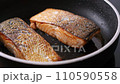 Pan-fried Salmon. Cooking salmon in a pan. 110590558