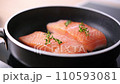 Pan-fried Salmon. Cooking salmon in a pan. 110593081