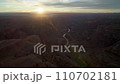 flying over Colorado river and grand Canyon sanstone rocks by sunset 110702181