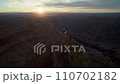 The rays of the sun before sunset illuminate the red rocks of the Grand Canyon 110702182