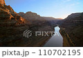 sunset fly over the Colorado River and sandstone rocks in sunset light in Grand Canyon National Park 110702195