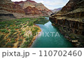 Traveling through the canyons of Colorado river and its layers of sandstone rock, green plants summer shore, Grand Canyon, Arizona 110702460
