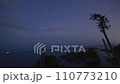 Timelapse of the night sky and pine trees in Oshima, Kesennuma City 110773210