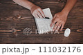 Close up of man receiving pills. People take pills. Pills and drugs top view 111032176