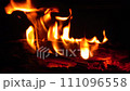 zooming out close-up fire burns firewood in fireplace 111096558