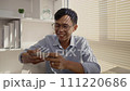 Man playing games on mobile phone with fun, Enjoy playing games on your smartphone, Happy time. 111220686