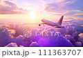 Passenger plane flies above the clouds during the sunrise 111363707