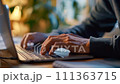 Close-up hands editor using a laptop 111363715