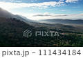 Scenic view: Valley, mountains, clouds sun in natural landscape 111434184